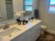 Elegant bathroom with double vanity, quartz countertops, and shower at 202 Andrews St, East Spencer, NC 28039