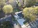 Aerial view of a home showing the spacious backyard, driveway, and surrounding neighborhood at 4132 Shamrock Dr, Charlotte, NC 28215