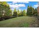 Landscaped backyard with lush greenery and open space at 14307 San Paolo Ln # 5102, Charlotte, NC 28277