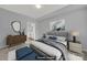 Virtually staged bedroom with gray walls and a plush bed at 14307 San Paolo Ln # 5102, Charlotte, NC 28277