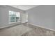 Bright bedroom featuring a large window and neutral decor at 14307 San Paolo Ln # 5102, Charlotte, NC 28277