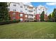 Brick building exterior with landscaping and balconies at 14307 San Paolo Ln # 5102, Charlotte, NC 28277