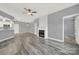 Open living room with kitchen and fireplace at 14307 San Paolo Ln # 5102, Charlotte, NC 28277