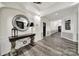 Elegant lobby with decorative mirror and dark wood floors at 14307 San Paolo Ln # 5102, Charlotte, NC 28277