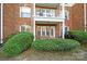 Ground level patio with brick exterior and green landscaping at 14307 San Paolo Ln # 5102, Charlotte, NC 28277