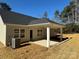Rear view of the house with a covered patio and AC unit at 112 Imperial Way # 2A, Albemarle, NC 28001