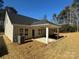 Rear view of the house with a covered patio and AC unit at 112 Imperial Way # 2A, Albemarle, NC 28001