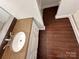 Bathroom shows vanity with granite counters, and wood look tile flooring at 131 Glendale Se Ave, Concord, NC 28025