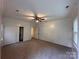 Spacious bedroom features neutral carpeting, closet space, and natural light at 131 Glendale Se Ave, Concord, NC 28025