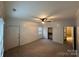 Bright bedroom with neutral carpet, closet space, ceiling fan and great natural light at 131 Glendale Se Ave, Concord, NC 28025