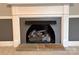Close-up of a cozy fireplace with decorative mantel and hearth at 131 Glendale Se Ave, Concord, NC 28025
