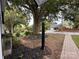 Landscaped front yard featuring a lamp post, mulch beds and a brick walkway at 131 Glendale Se Ave, Concord, NC 28025