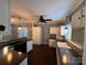 Bright kitchen featuring white cabinetry, modern backsplash, and stainless steel appliances at 131 Glendale Se Ave, Concord, NC 28025