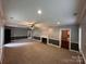 Spacious living room with carpeted floors, a fireplace, and access to other areas of the house at 131 Glendale Se Ave, Concord, NC 28025