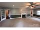 Comfortable living room featuring neutral carpet, fireplace, and ample natural light at 131 Glendale Se Ave, Concord, NC 28025