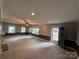 Bright living room with neutral tones, featuring a fireplace and natural light from multiple windows at 131 Glendale Se Ave, Concord, NC 28025
