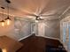 Cozy living room with hardwood floors, modern lighting, and neutral paint colors at 131 Glendale Se Ave, Concord, NC 28025