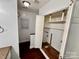 Bathroom featuring wooden floors and white walls, with an open storage area under the sink at 131 Glendale Se Ave, Concord, NC 28025