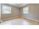 Well-lit bedroom with tile floors and two windows at 2721 Dora Dr, Charlotte, NC 28215