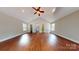 Large main bedroom with hardwood floors and access to the bathroom at 2721 Dora Dr, Charlotte, NC 28215