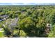 Property surrounded by lush trees with a city skyline view at 3444 Marvin Rd, Charlotte, NC 28211