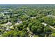 Aerial view of neighborhood with homes and surrounding trees at 3444 Marvin Rd, Charlotte, NC 28211