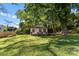 White house with boarded windows, needs renovation. Brick foundation, front porch at 3444 Marvin Rd, Charlotte, NC 28211