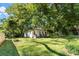 White house with boarded windows, needs renovation. Brick foundation, front porch at 3444 Marvin Rd, Charlotte, NC 28211