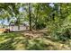 White house with mature trees and green grass at 3444 Marvin Rd, Charlotte, NC 28211
