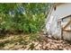 White house exterior, side yard view with bamboo at 3444 Marvin Rd, Charlotte, NC 28211