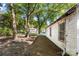 White house exterior, side yard view, needs work at 3444 Marvin Rd, Charlotte, NC 28211