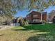 Expansive backyard, showcasing the home and pool area at 3481 Fieldstone Dr, Gastonia, NC 28056
