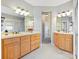 Double vanity bathroom with light grey walls and updated fixtures at 3481 Fieldstone Dr, Gastonia, NC 28056
