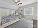 Charming bedroom with grey walls, ceiling fan, and window at 3481 Fieldstone Dr, Gastonia, NC 28056