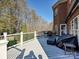 Spacious deck with seating area, grill, and wooded backdrop at 3481 Fieldstone Dr, Gastonia, NC 28056