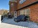 Large deck features seating area and partial home view at 3481 Fieldstone Dr, Gastonia, NC 28056