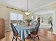 Elegant dining room with hardwood floors, an arched doorway, and views to living room at 3481 Fieldstone Dr, Gastonia, NC 28056