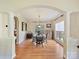Bright dining room features hardwood floors, a charming table, and large windows at 3481 Fieldstone Dr, Gastonia, NC 28056