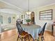Open dining room with hardwood floors, a round table, and views into the living room at 3481 Fieldstone Dr, Gastonia, NC 28056