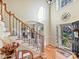 Two-story entryway with hardwood floors and a grand staircase at 3481 Fieldstone Dr, Gastonia, NC 28056