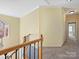 Spacious hallway with neutral paint and carpet at 3481 Fieldstone Dr, Gastonia, NC 28056