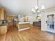 Open kitchen features stainless steel appliances and hardwood floors at 3481 Fieldstone Dr, Gastonia, NC 28056
