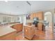 Modern kitchen with light wood cabinets, an island, stainless steel appliances, and ample counter space at 3481 Fieldstone Dr, Gastonia, NC 28056