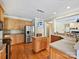 Bright kitchen with island, stainless steel appliances, and hardwood floors at 3481 Fieldstone Dr, Gastonia, NC 28056