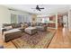 Spacious living room with hardwood floors, a large sectional sofa, and an open floor plan at 3481 Fieldstone Dr, Gastonia, NC 28056