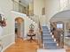 Elegant staircase with wrought-iron railings and hardwood floors at 3481 Fieldstone Dr, Gastonia, NC 28056