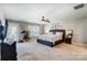 Main bedroom with carpeted floors and private access to balcony at 4423 Falls Lake Sw Dr, Concord, NC 28025