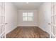 Bright sitting room with hardwood floors and French doors at 5043 Antebellum Dr, Iron Station, NC 28080