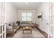 Cozy sitting room with hardwood floors and French doors at 5043 Antebellum Dr, Iron Station, NC 28080