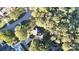 Overhead aerial shot showcasing the house nestled among mature trees and a winding street at 1000 Hunting Ave, Lincolnton, NC 28092